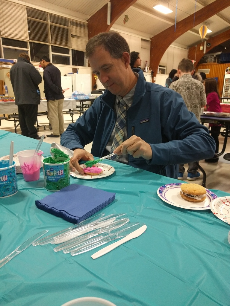 Mr. Barth decorates a cookie at the SEPAC family night!
